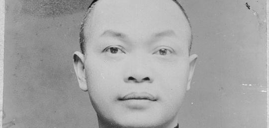 a black and white image of a man.