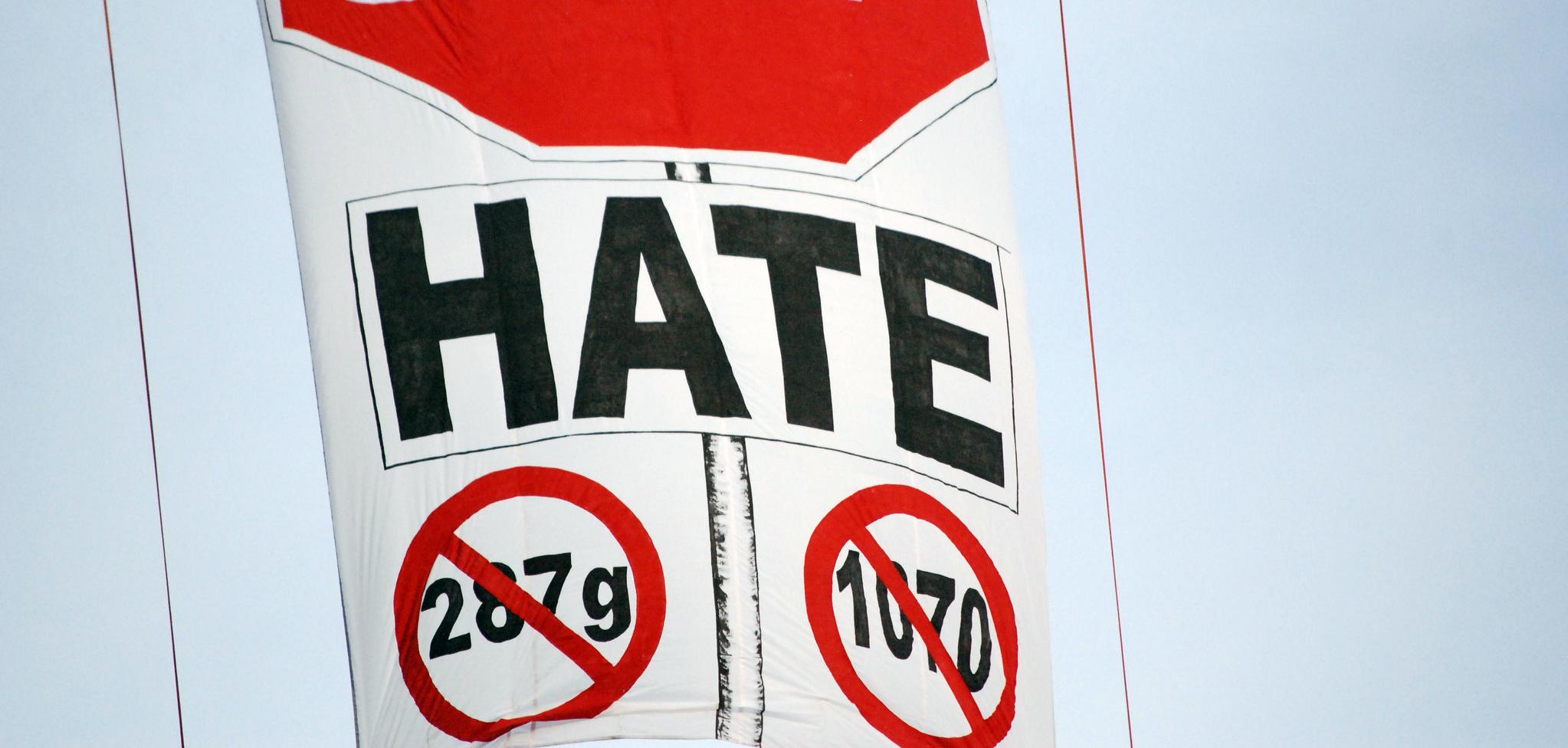 A banner that reads "Stop Hate" and crosses out 287g and 1070