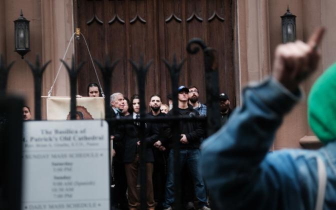 Abortion activists gather outside of the Basilica of St. Patricks Old Cathedral, a Catholic church in downtown Manhattan, on May 7, 2022, while anti-abortion activists and worshippers look on.