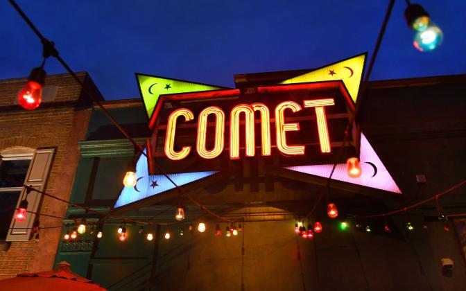 Sign in front of building that reads "COMET" - Comet Ping Pong in Washington, D.C., which was the focal point of the Pizzagate conspiracy theory