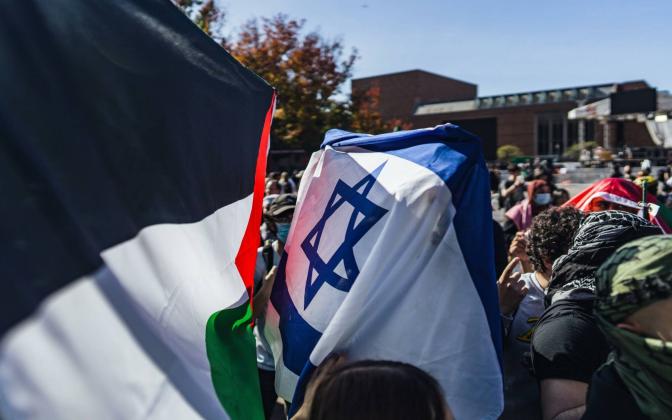 a clash of the israeli and palestinian flags.