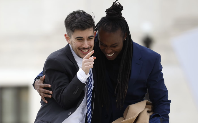 two people hugging and laughing