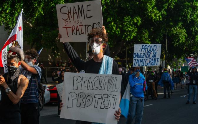 protestors holding signs