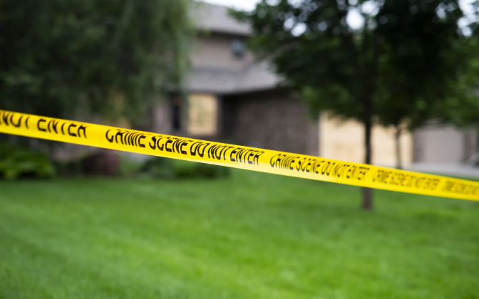 caution tape on the perimeter of a house